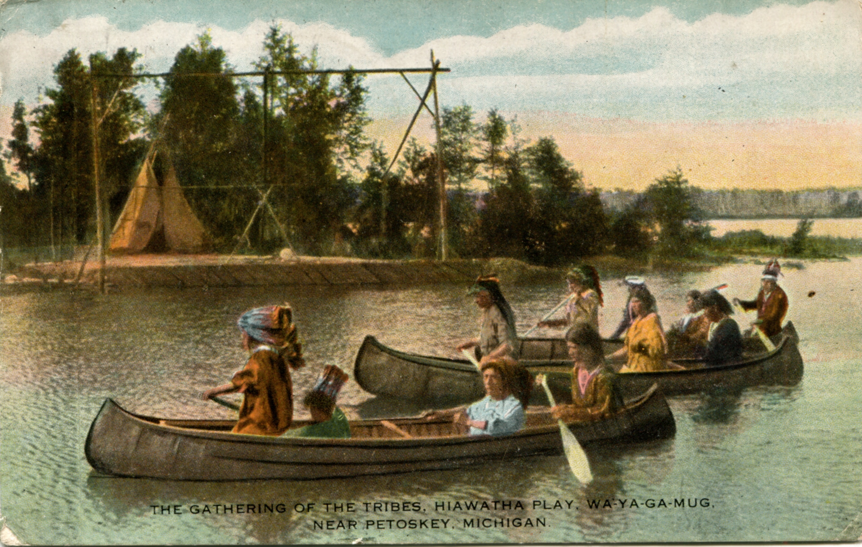 A full-color vintage postcard. Souvenir from the Hiawatha Play performed near Hemingway's family's summer cabin.  The image shows "the gathering of the tribes" arriving by canoe.