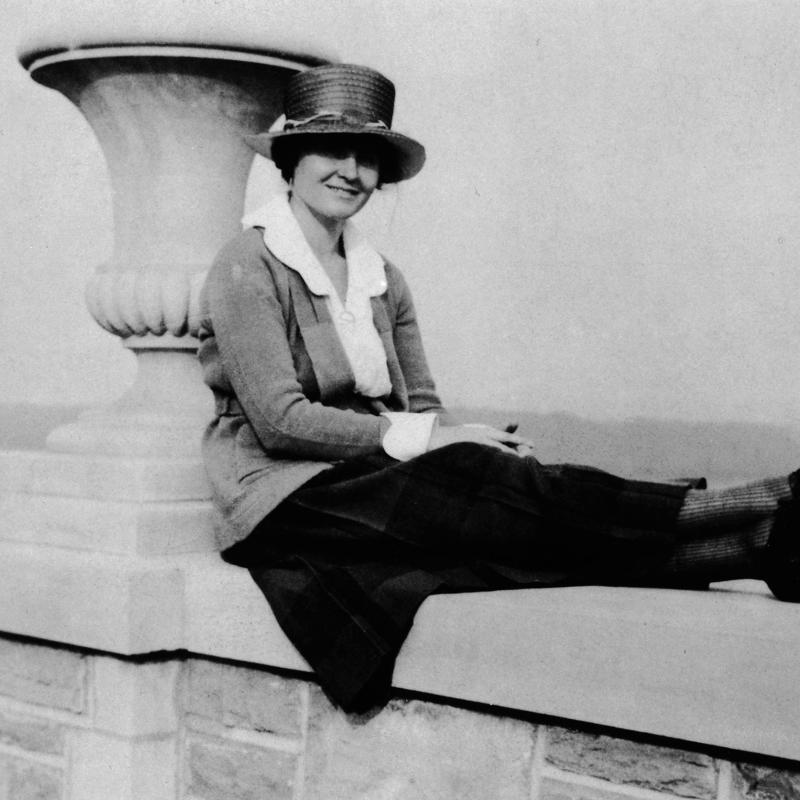 Hadley Richardson Hemingway sitting on a stone wall by the water. ***UPDATE