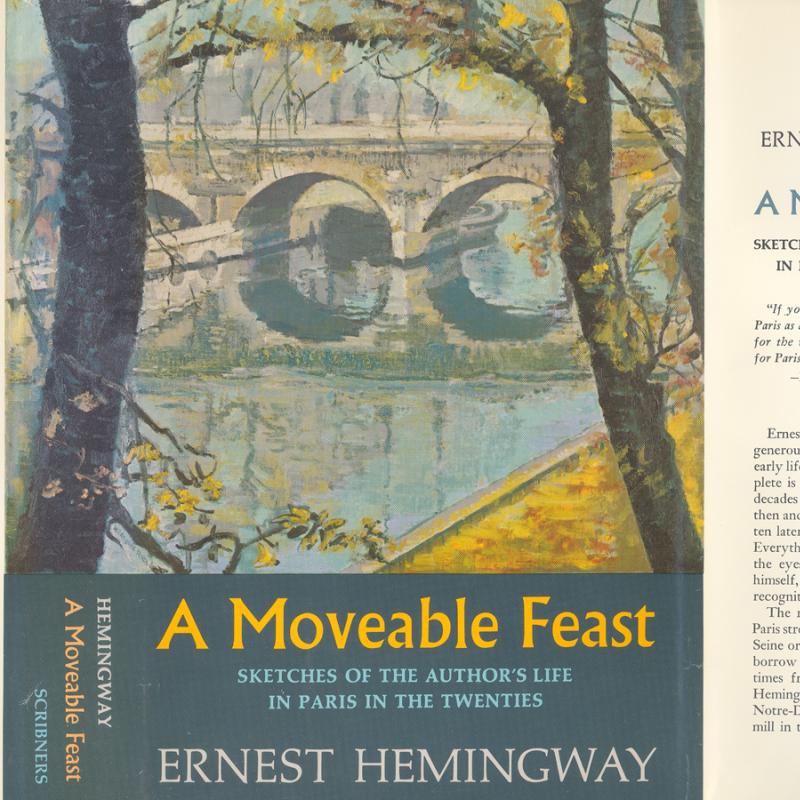 A scan of the 1st edition dustjacket of Hemingway's A Moveable Feast.  The featured image is a painting of a stone bridge viewed through trees with sparse foliage in yellow and green.  Part of a quai is visible at the edge of the image, done in yellow, suggestive of fallen autumn leaves.  The title is in yellow text on a blue background; the author's full name is in white on blue.